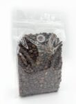 Transparent flat bottom bag filled with coffee beans